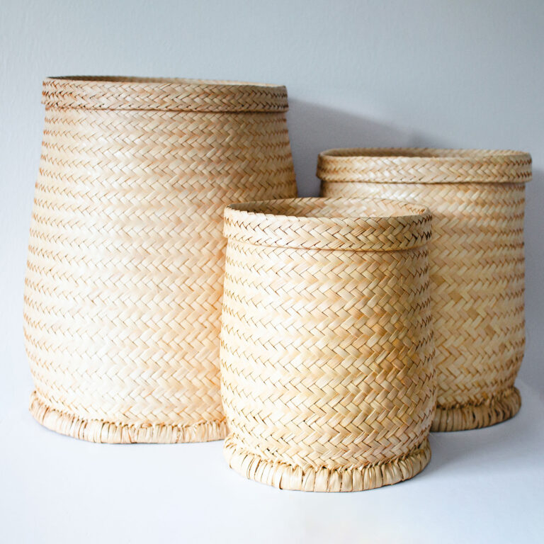 three different sized reed baskets